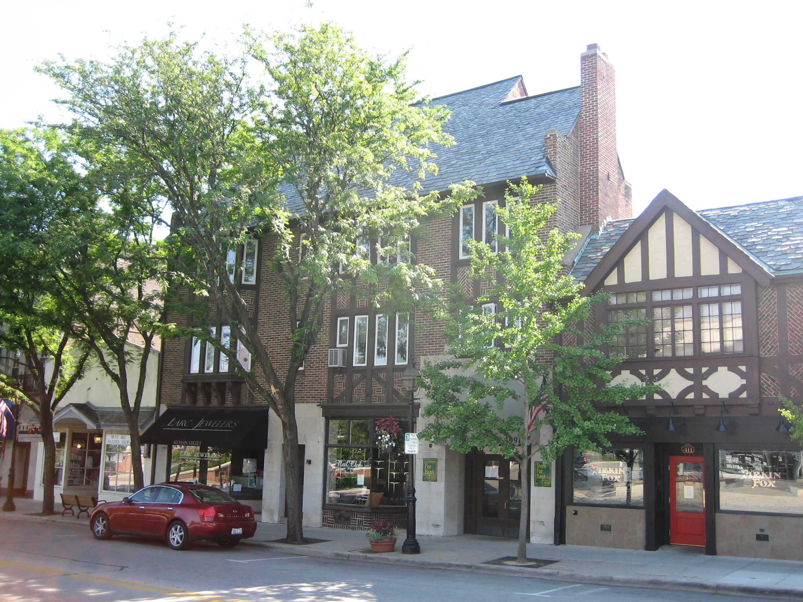 a building with a red car parked in front of it
